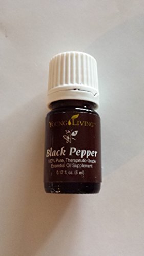 Young Living Black Pepper oil bottle pour for an energizing aroma.