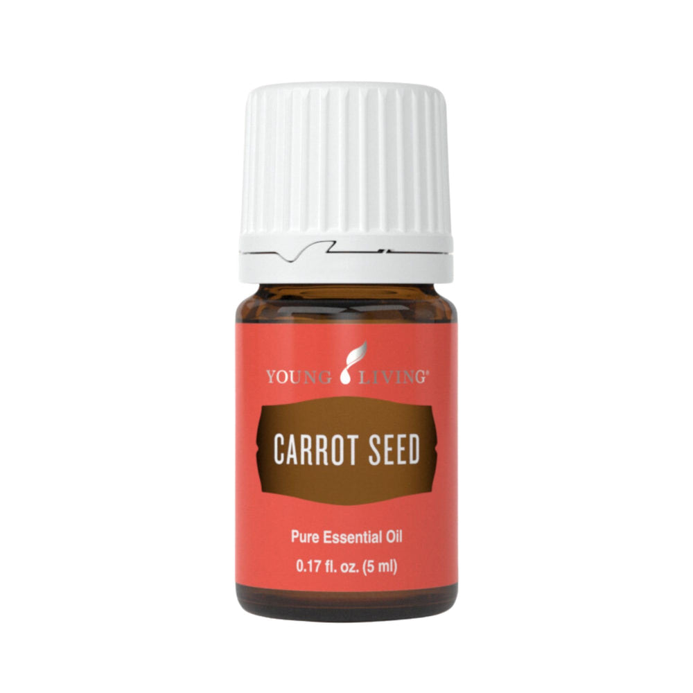 Young Living Carrot Seed Essential Oil bottle pour for quick skin hydration