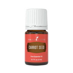 Young Living Carrot Seed Essential Oil bottle pour for quick skin hydration