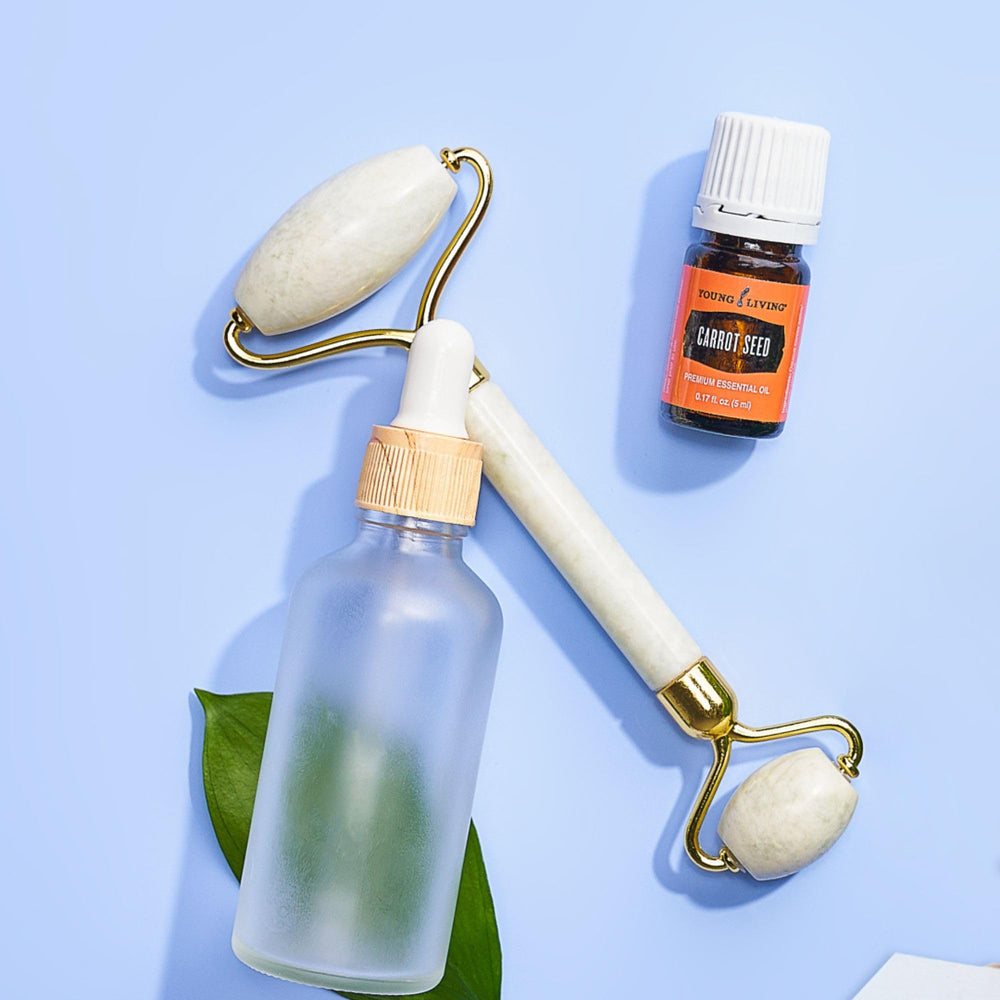 Applying Carrot Seed Essential Oil to skin with moisturizer for glow