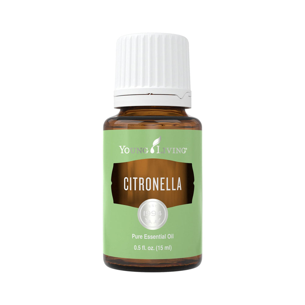 Young Living Citronella essential oil bottle on table for outdoor freshness.
