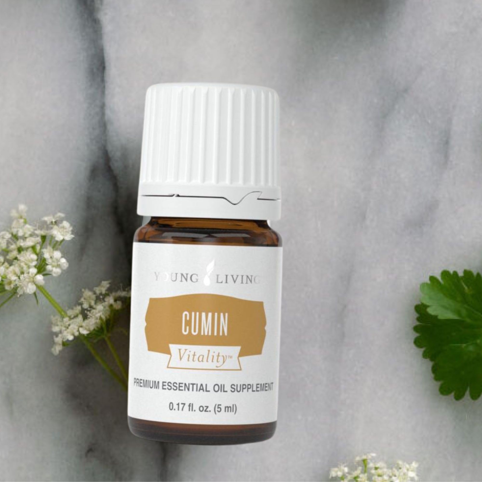 Young Living Cumin Vitality dropper dispensing oil for easy culinary use.