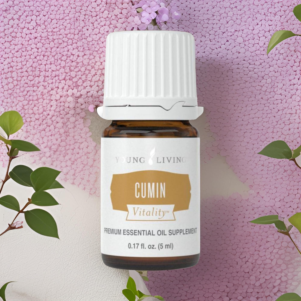 Young Living Cumin Vitality bottle on a clean kitchen counter ready for cooking.