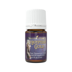 Young Living Egyptian Gold bottle with devotional aroma enhances meditation ambiance.