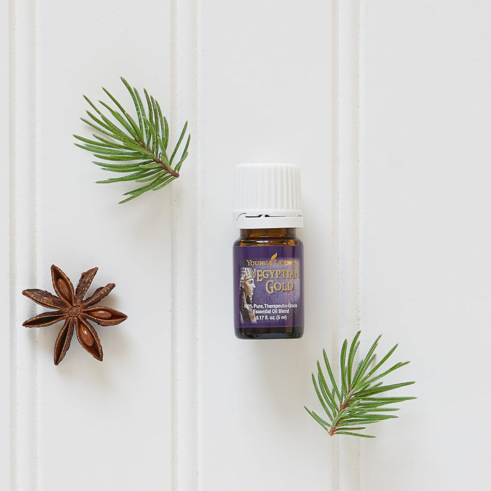 Young Living Egyptian Gold glass with warm glow suggests soothing relaxation sessions.