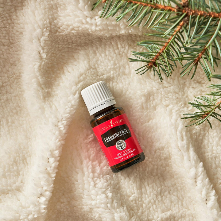 Young Living Frankincense in a diffuser room setup for a calming atmosphere.