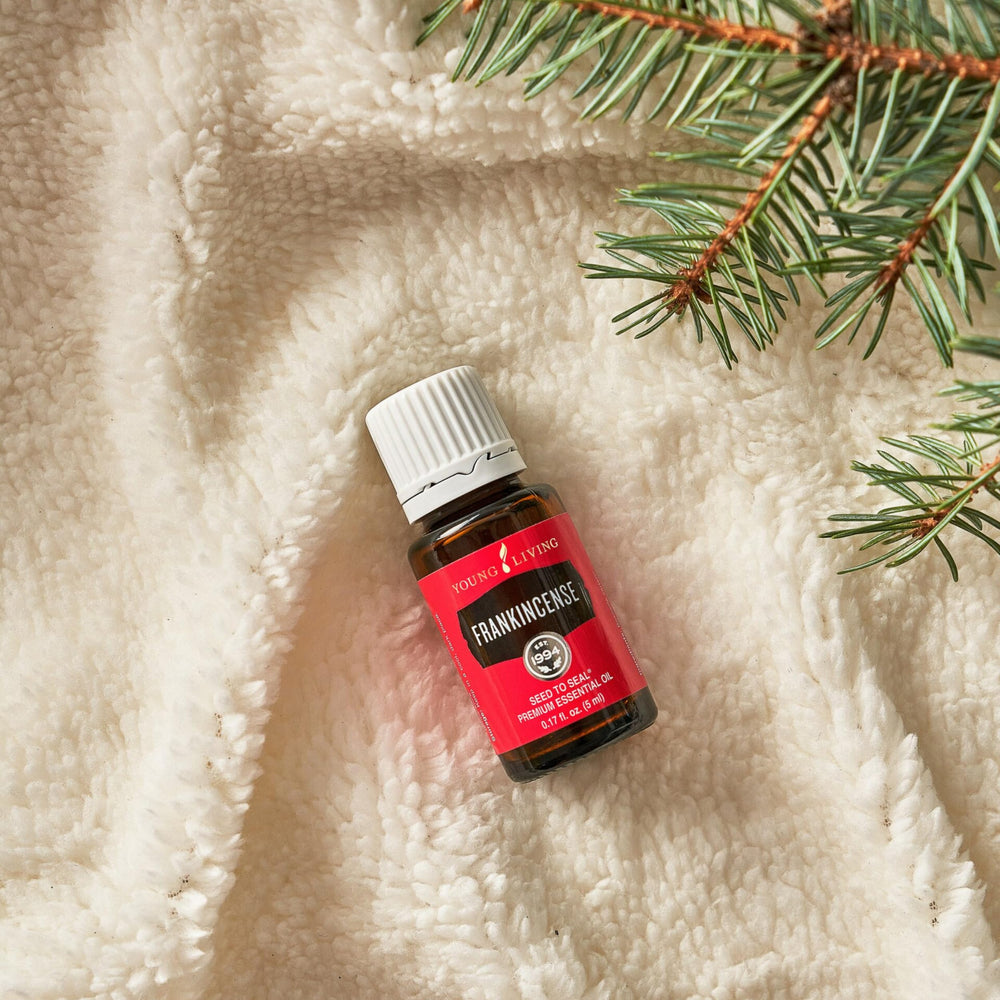 Young Living Frankincense in a diffuser room setup for a calming atmosphere.