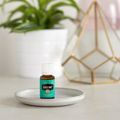 Young Living Gentle Baby being applied to tiny hands for gentle skin care.