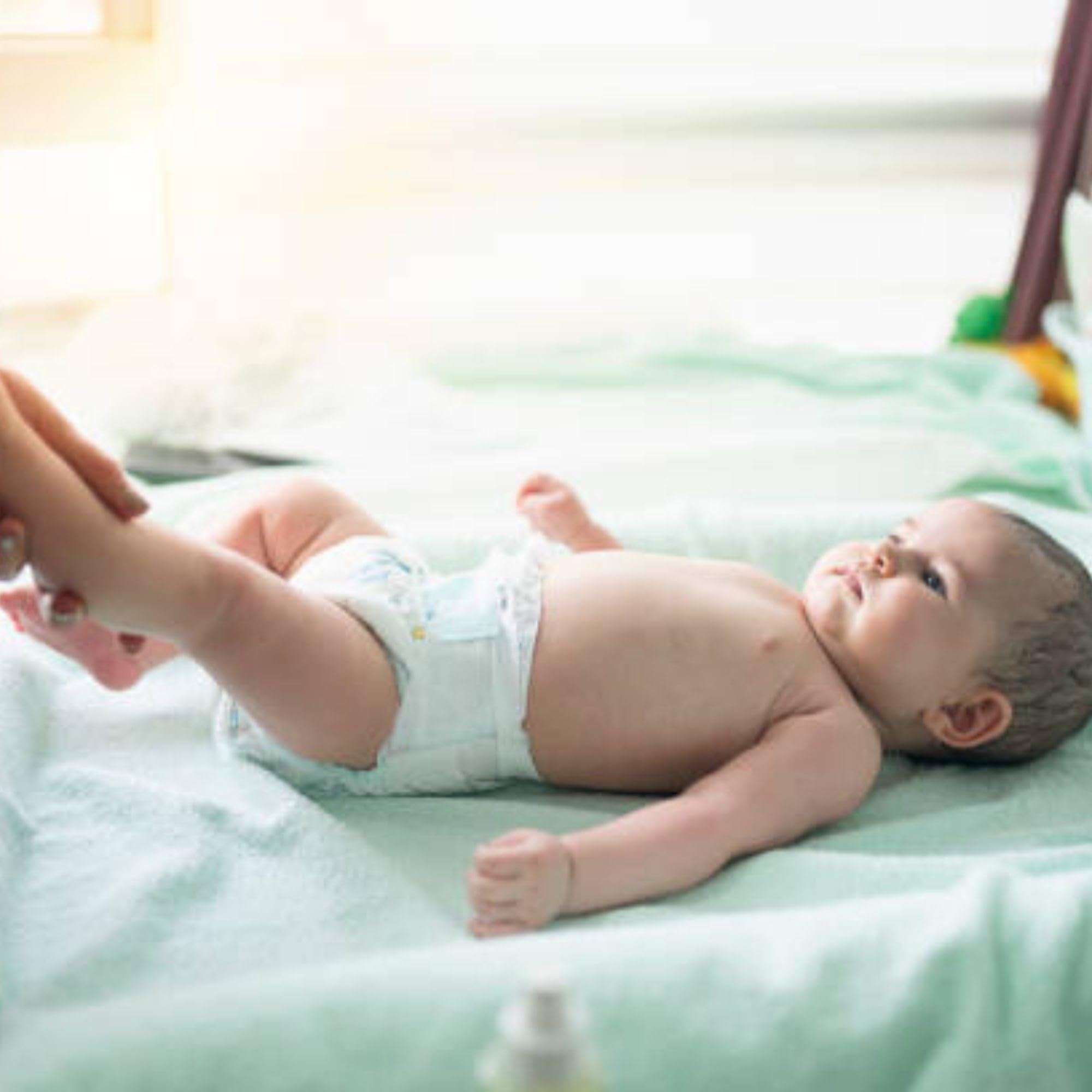 Young Living Gentle Baby massage stroke illustrating a soothing, comforting routine.