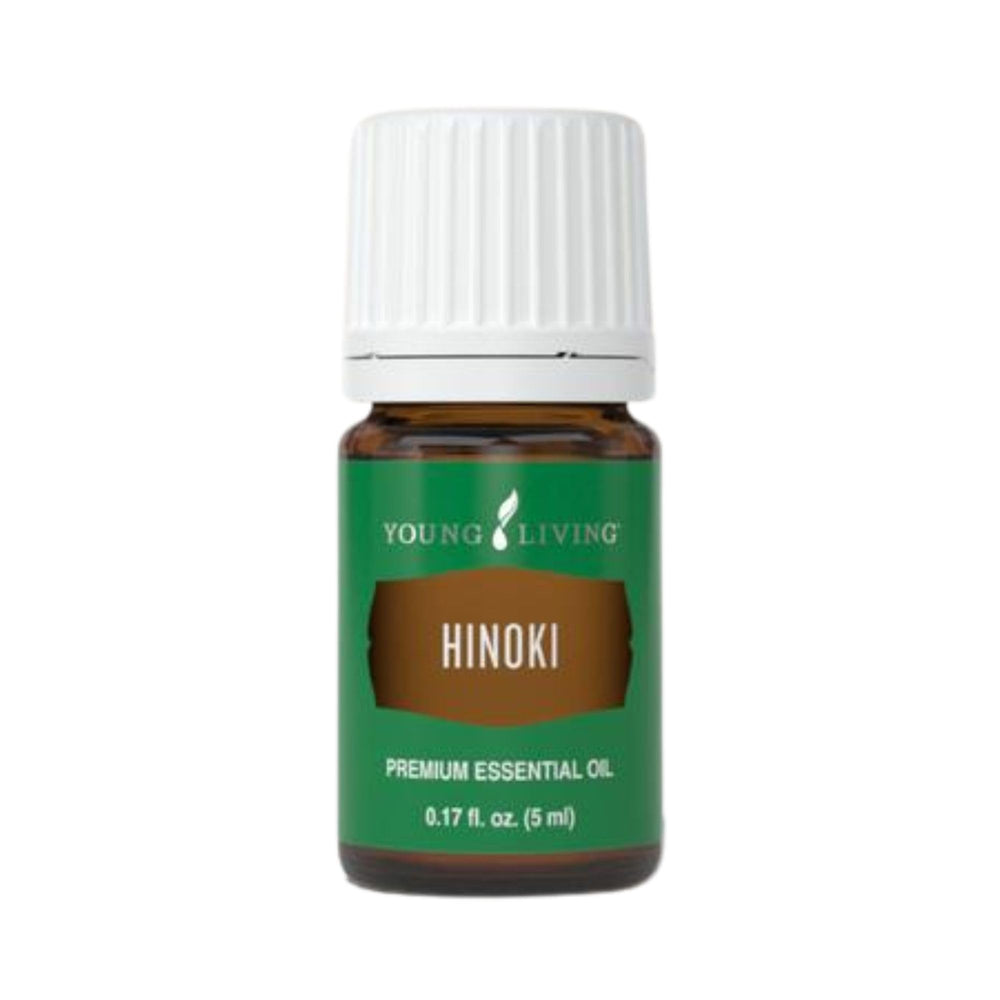 Young Living Hinoki essential oil bottle diffusing for a refreshing ambience.