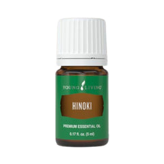 Young Living Hinoki essential oil bottle diffusing for a refreshing ambience.