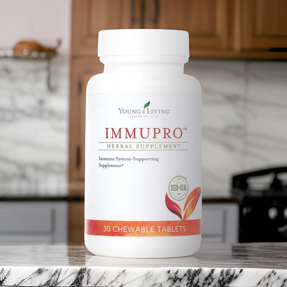 Young Living ImmuPro bottle in hand for on-the-go use