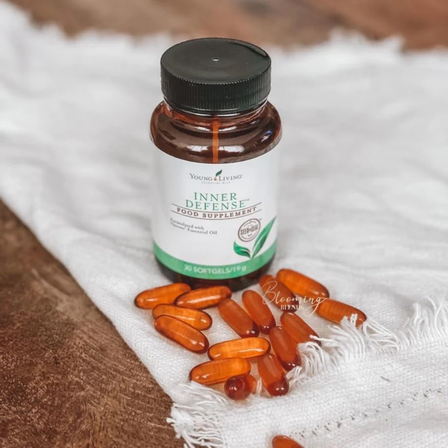 Young Living Inner Defense capsules dissolving in liquid close-up.