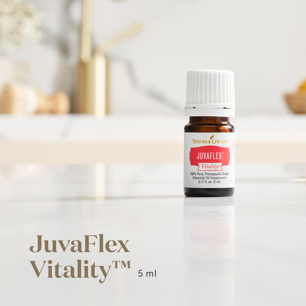 JuvaFlex Vitality bottle on counter beside fresh herbs for holistic care.