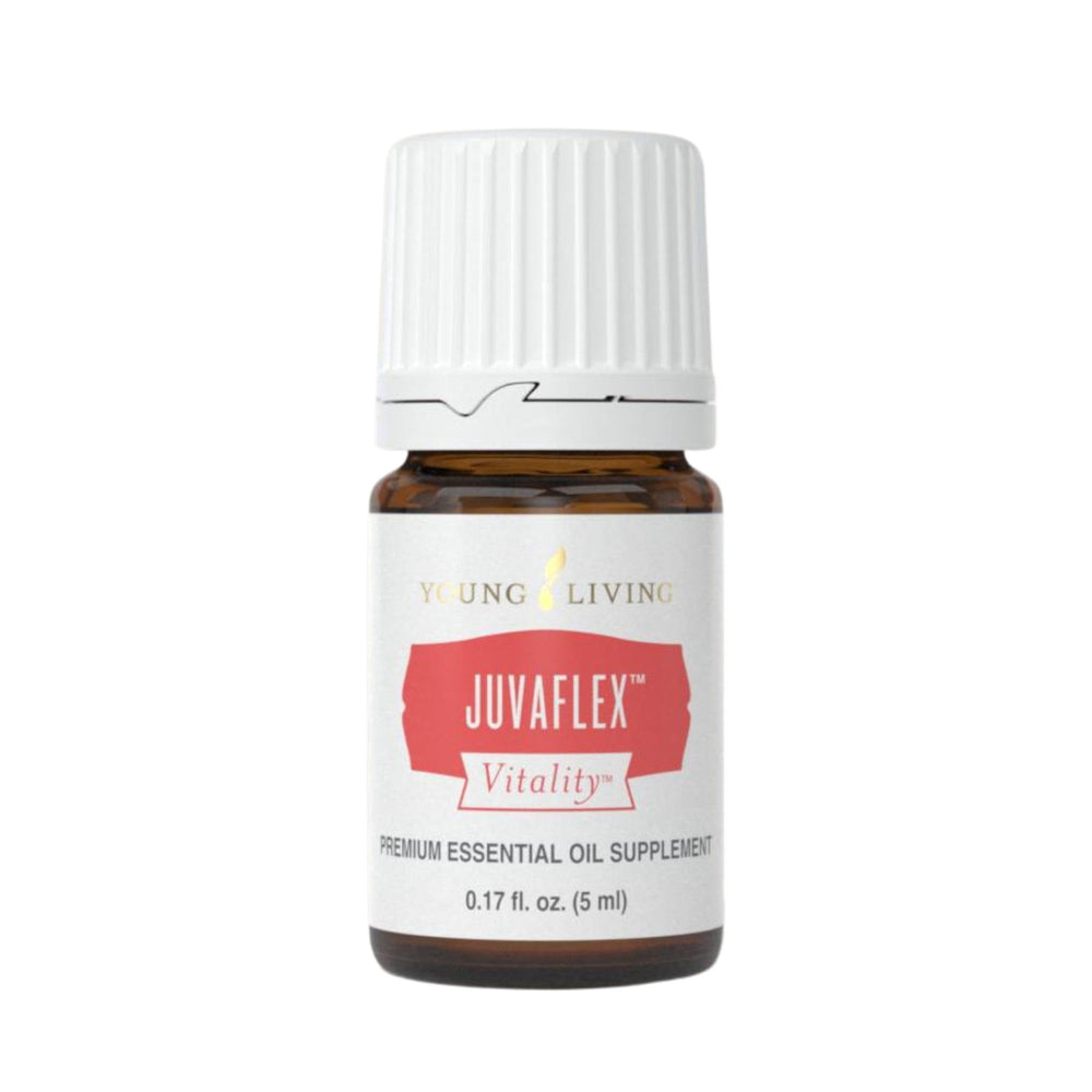 Young Living JuvaFlex Vitality bottle poured for daily wellness routine.