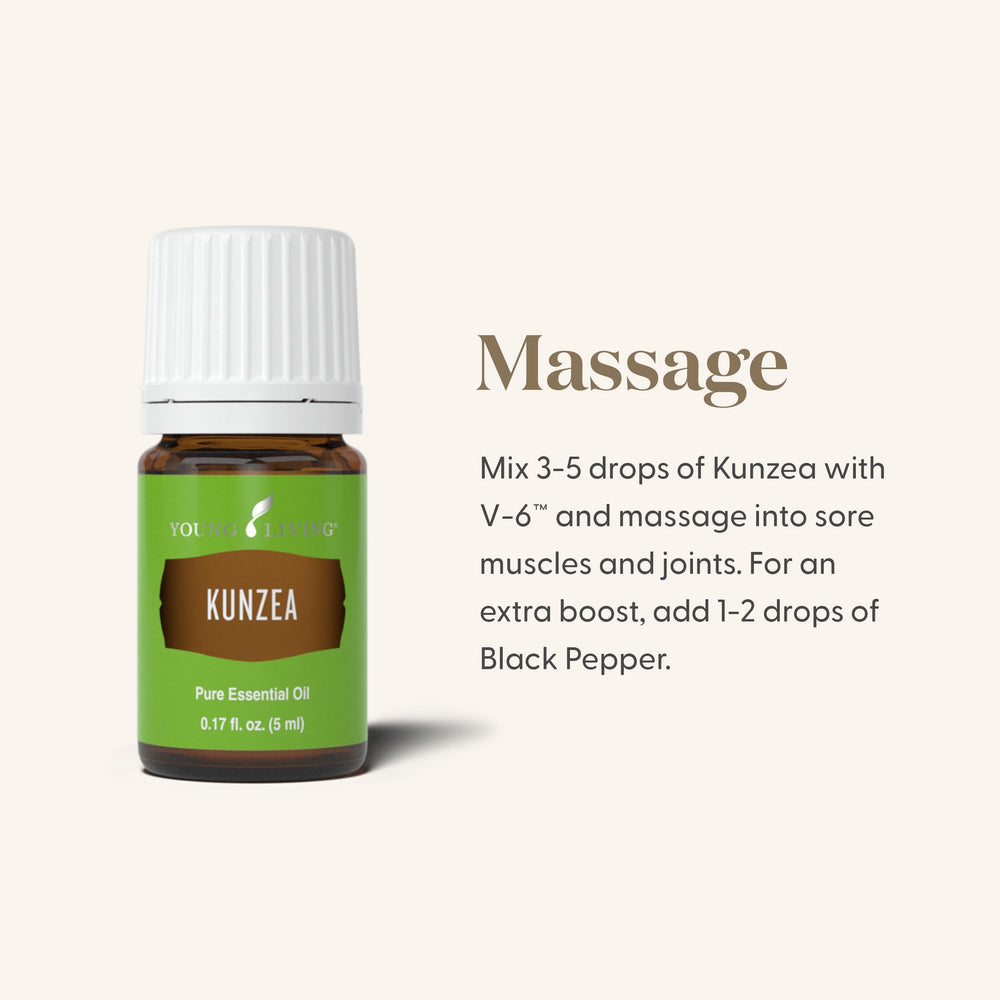 Young Living Kunzea essential oil drops on hand for topical use.