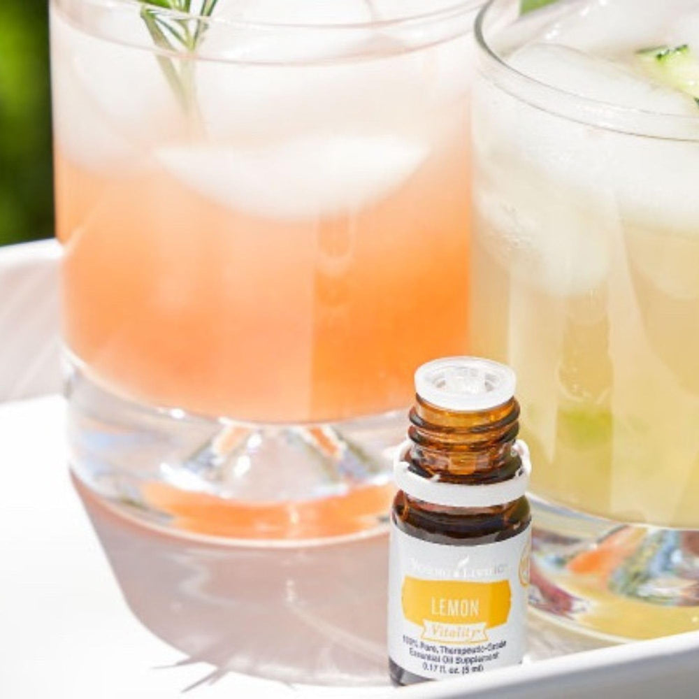 Young Living Lemon Vitality bottle in a kitchen setup for everyday flavor.