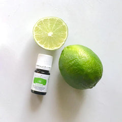 Young Living Lime Vitality bottle top view emphasizes compact culinary aid.
