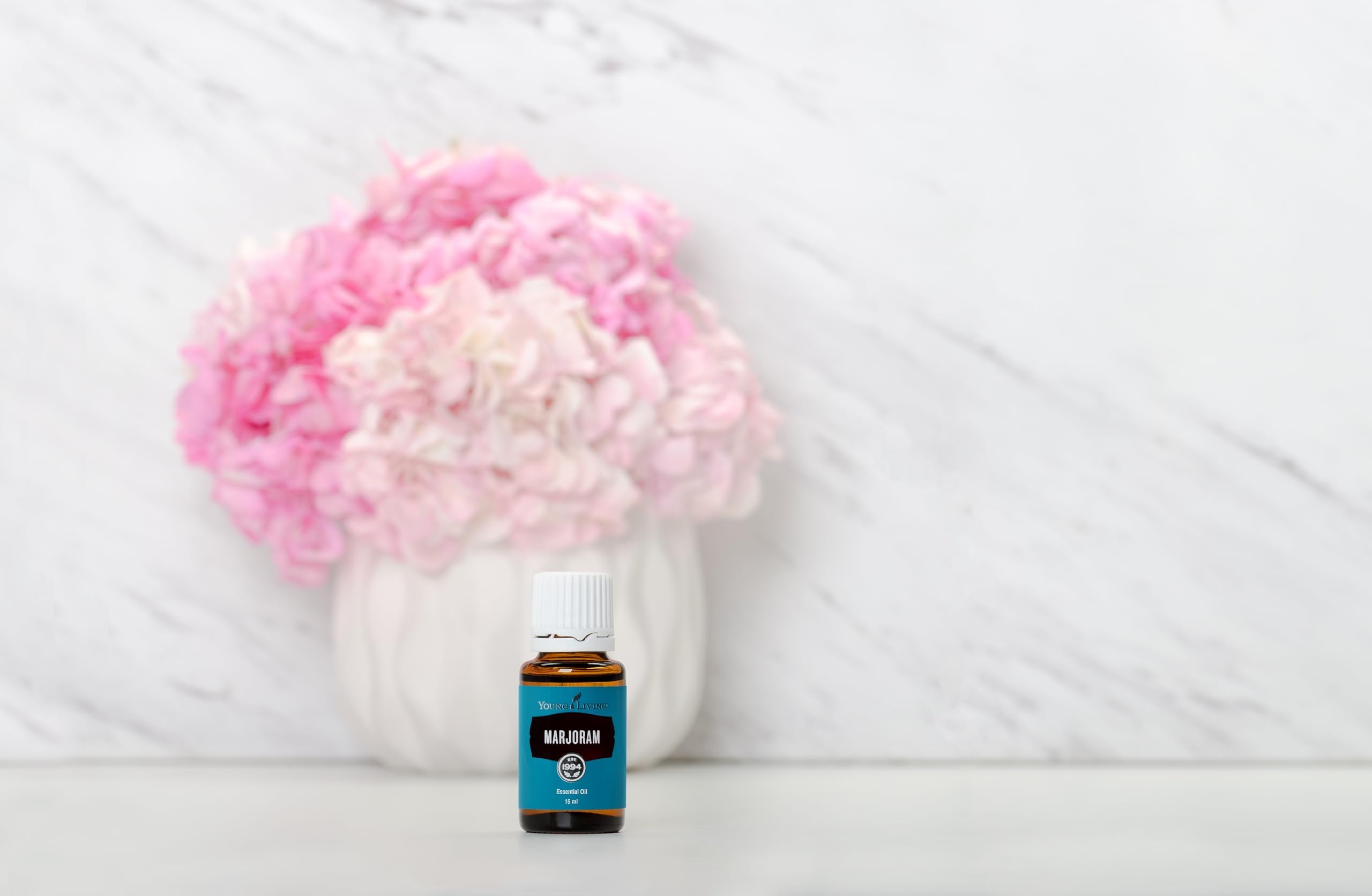 Close-up label of Young Living Marjoram oil featuring Herb of Happiness