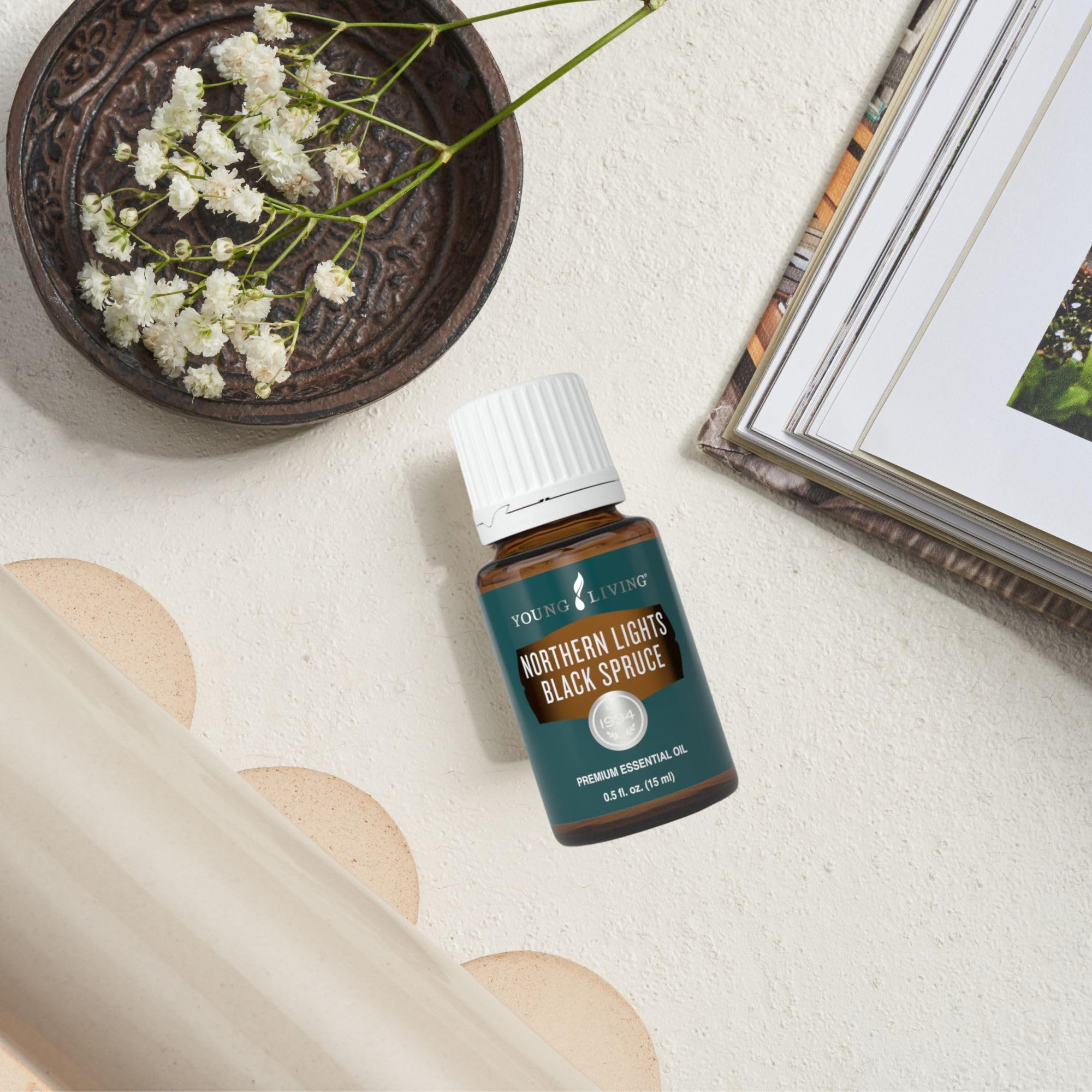 Young Living Northern Lights Black Spruce massage oil on skin during relaxation.