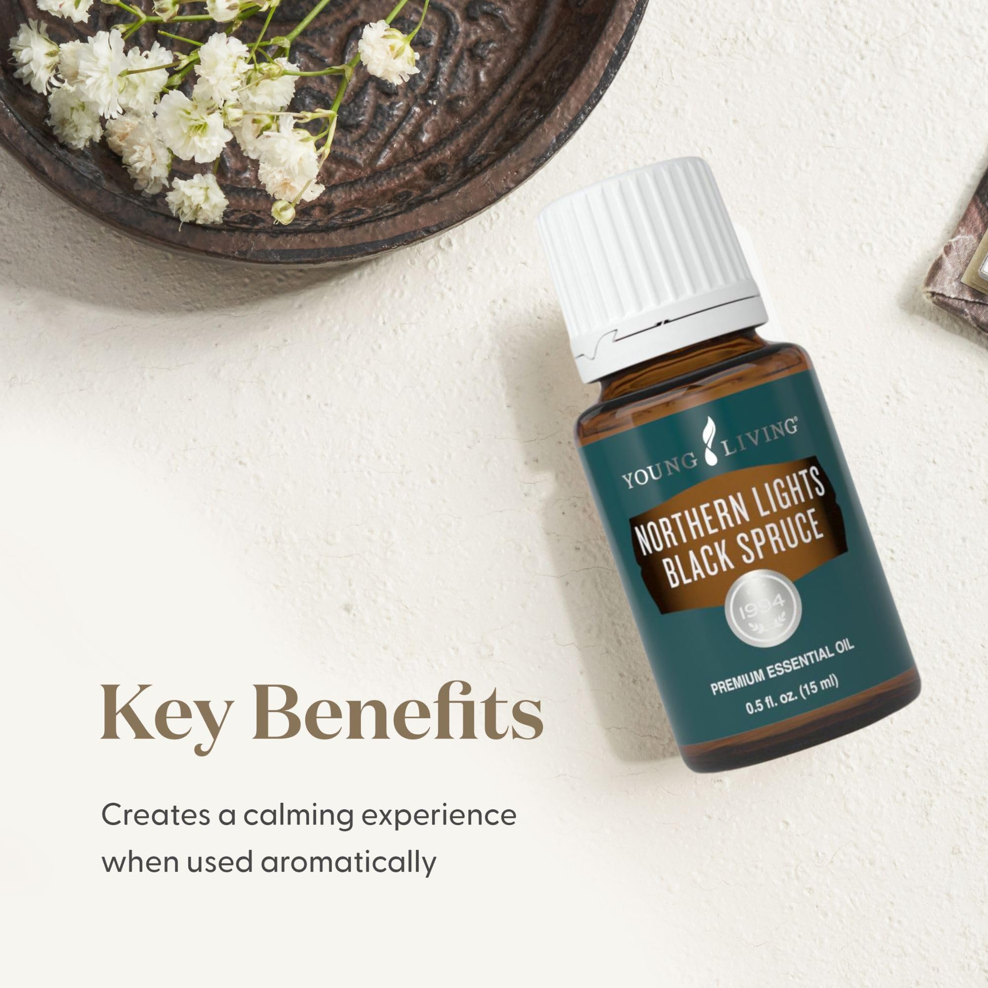 Young Living Northern Lights Black Spruce applied on skin for a refreshed look.