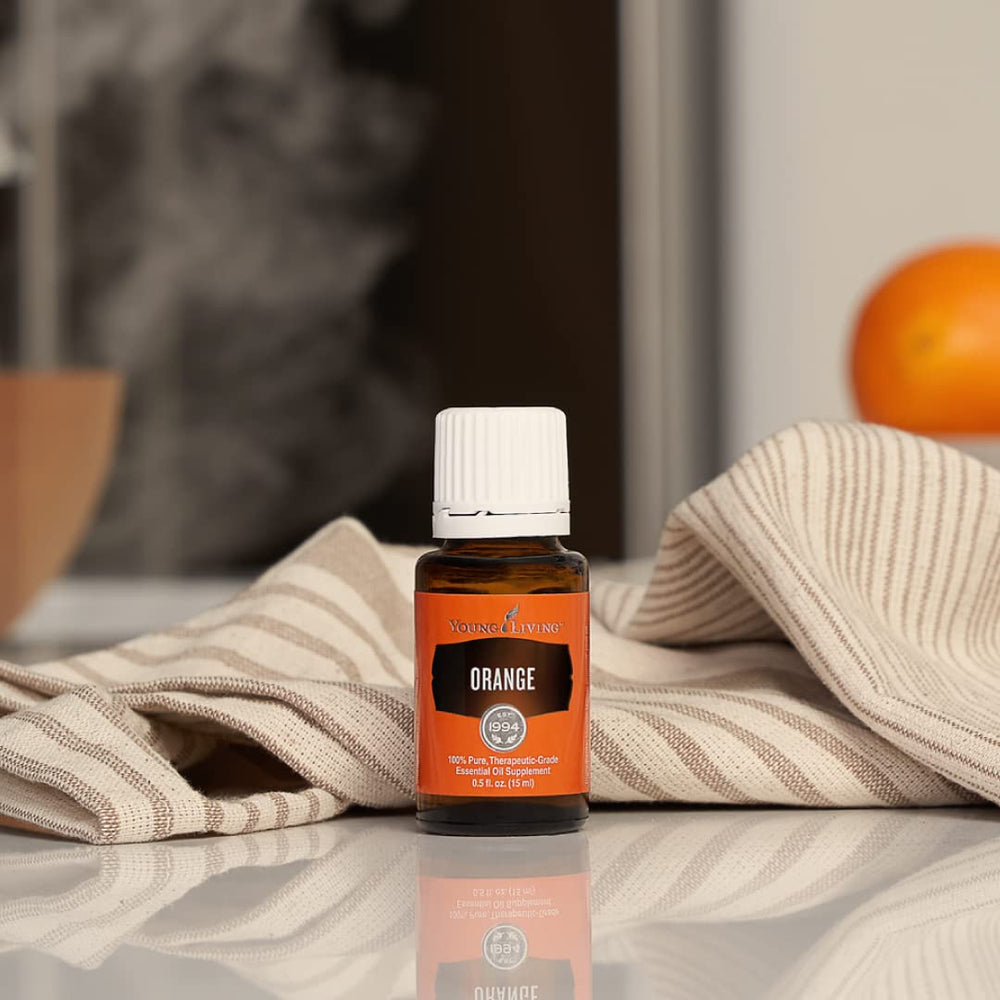 Blending Young Living Orange Oil with other oils for citrus aroma.