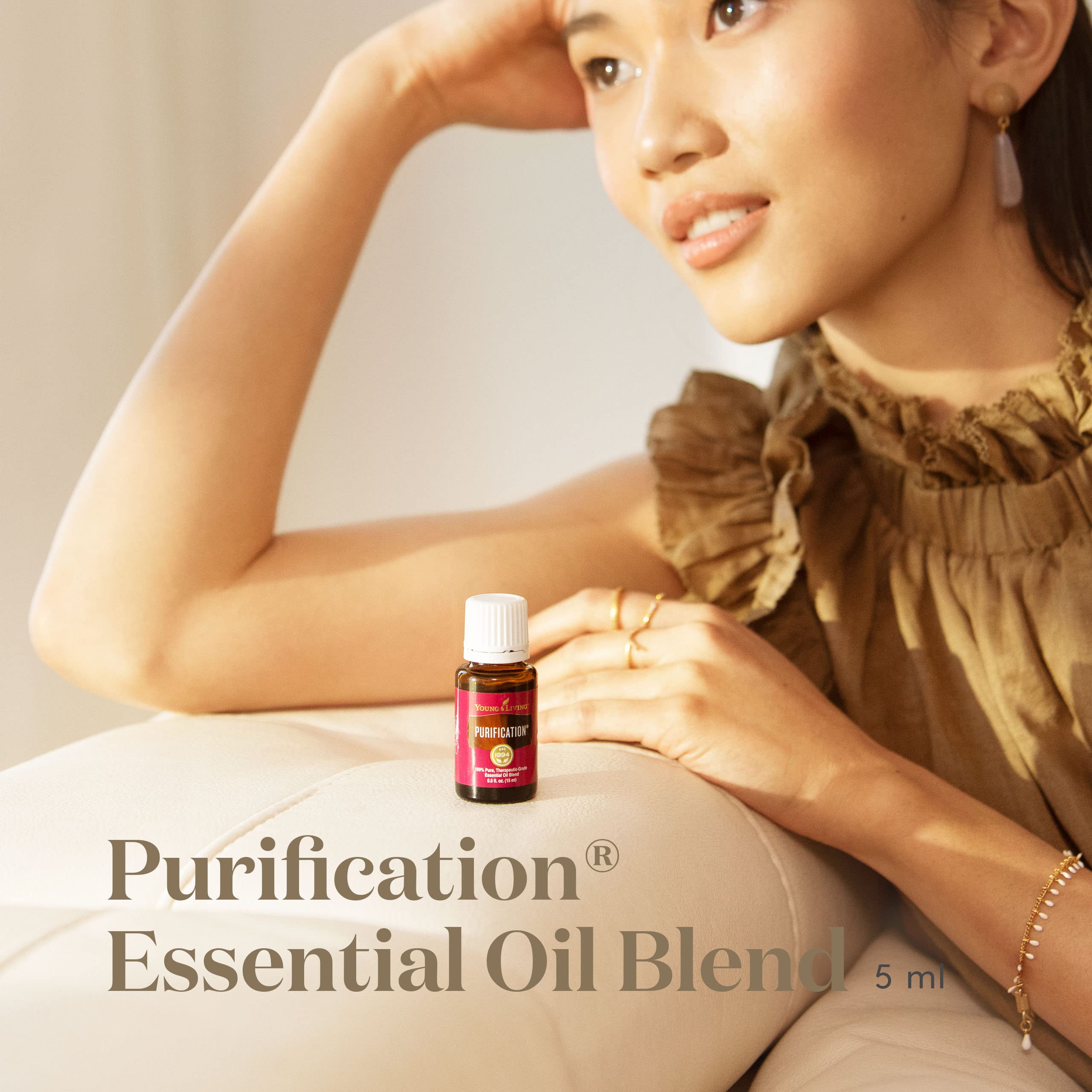 Young Living Purification 5ml bottle pour illustrates easy diffusion for airy spaces
