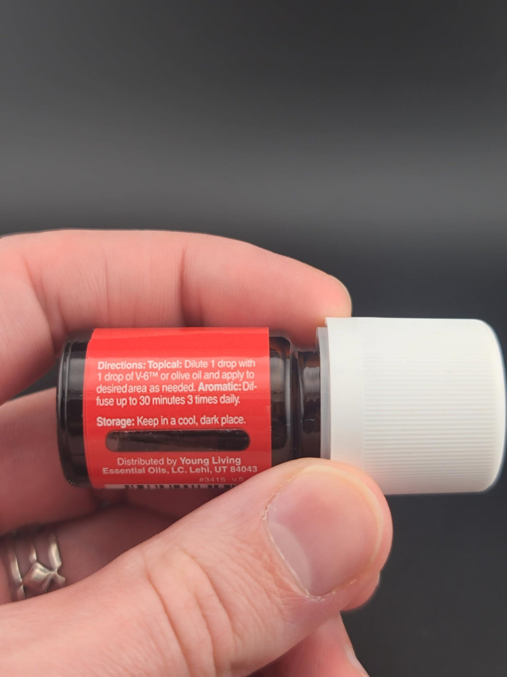 Droplet of Raven essential oil on cotton for easy blending at home.