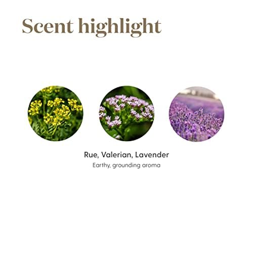 Young Living RutaVaLa Roll-On beside a nightstand and relaxing pillow.