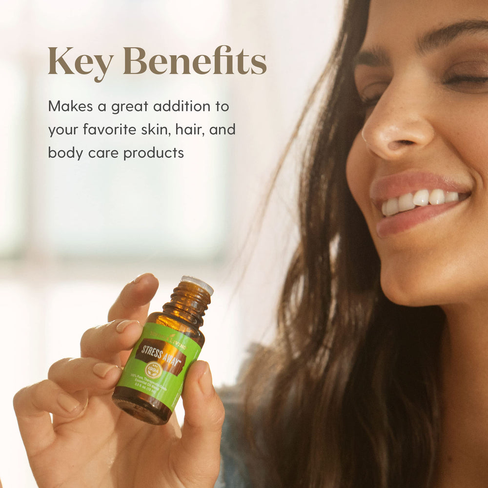 Amber Stress Away bottle pours with carrier oil for dilution.