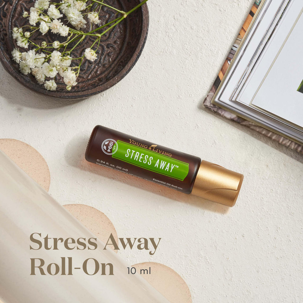 Young Living Stress Away Roll-On on the wrist for on-the-go relaxation.