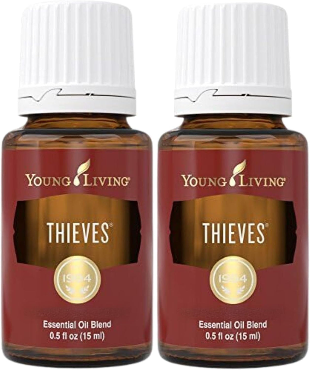 Young Living Thieves bottle beside a diffuser for a warm, inviting aroma.