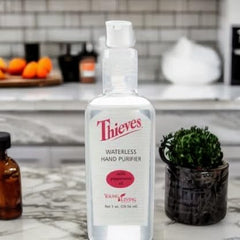 Young Living Thieves hand purifier on hands highlights convenient cleansing during daily activities.