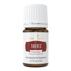 Young Living Thieves Vitality bottle pour, releasing a pure, refreshing aroma for daily use.