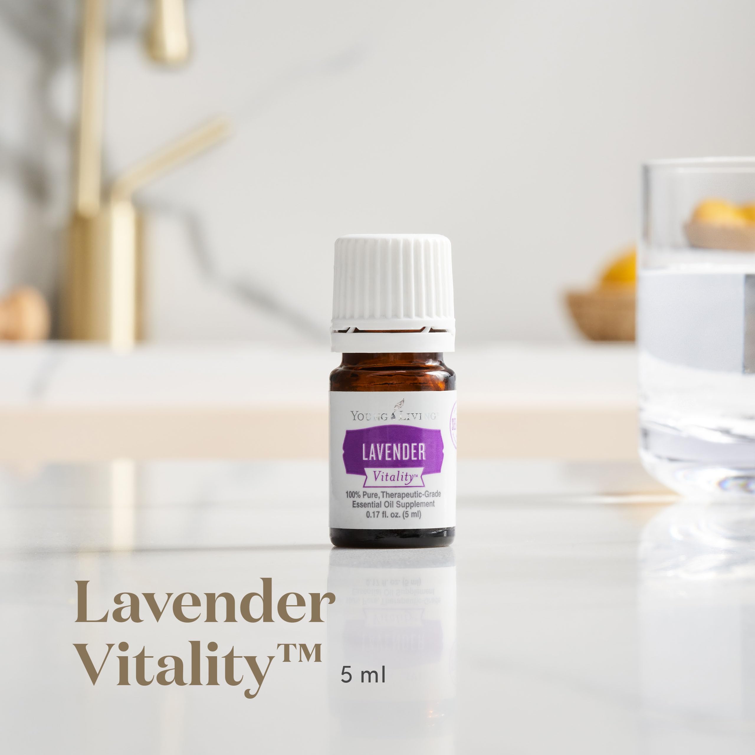 Pouring Young Living Vitality Lavender Oil for flavoring drinks