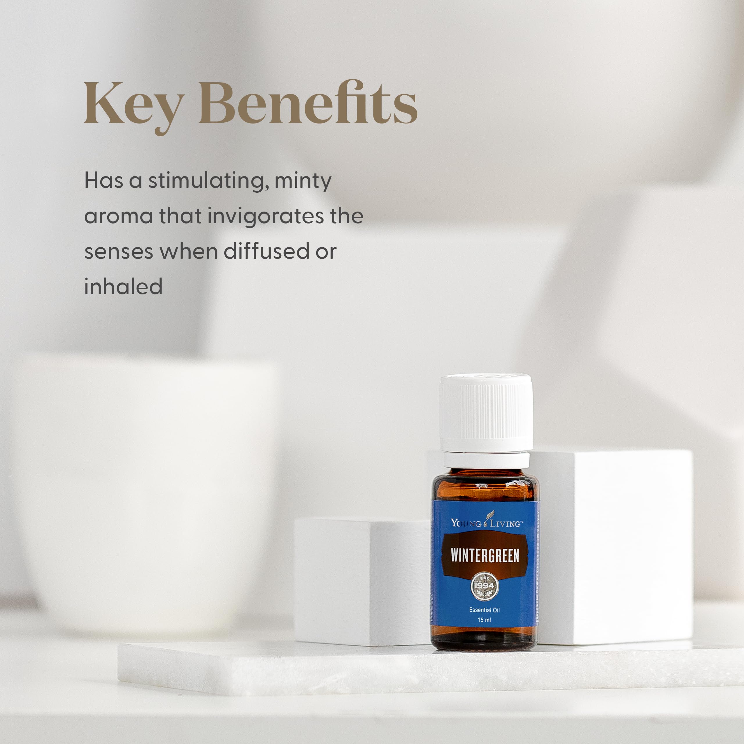 Young Living Wintergreen bottle pour captured for easy application and cooling scent.