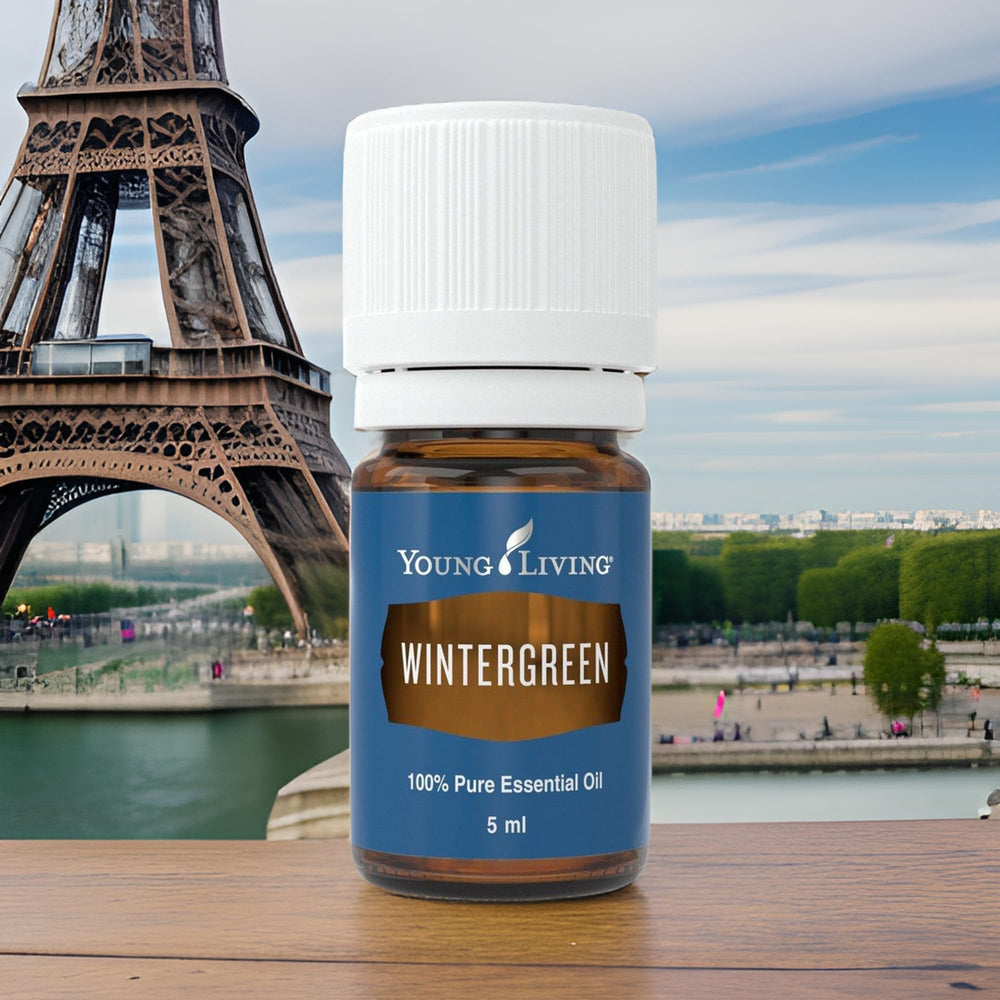 Young Living Wintergreen oil bottle on shelf, compact 5ml for travel.