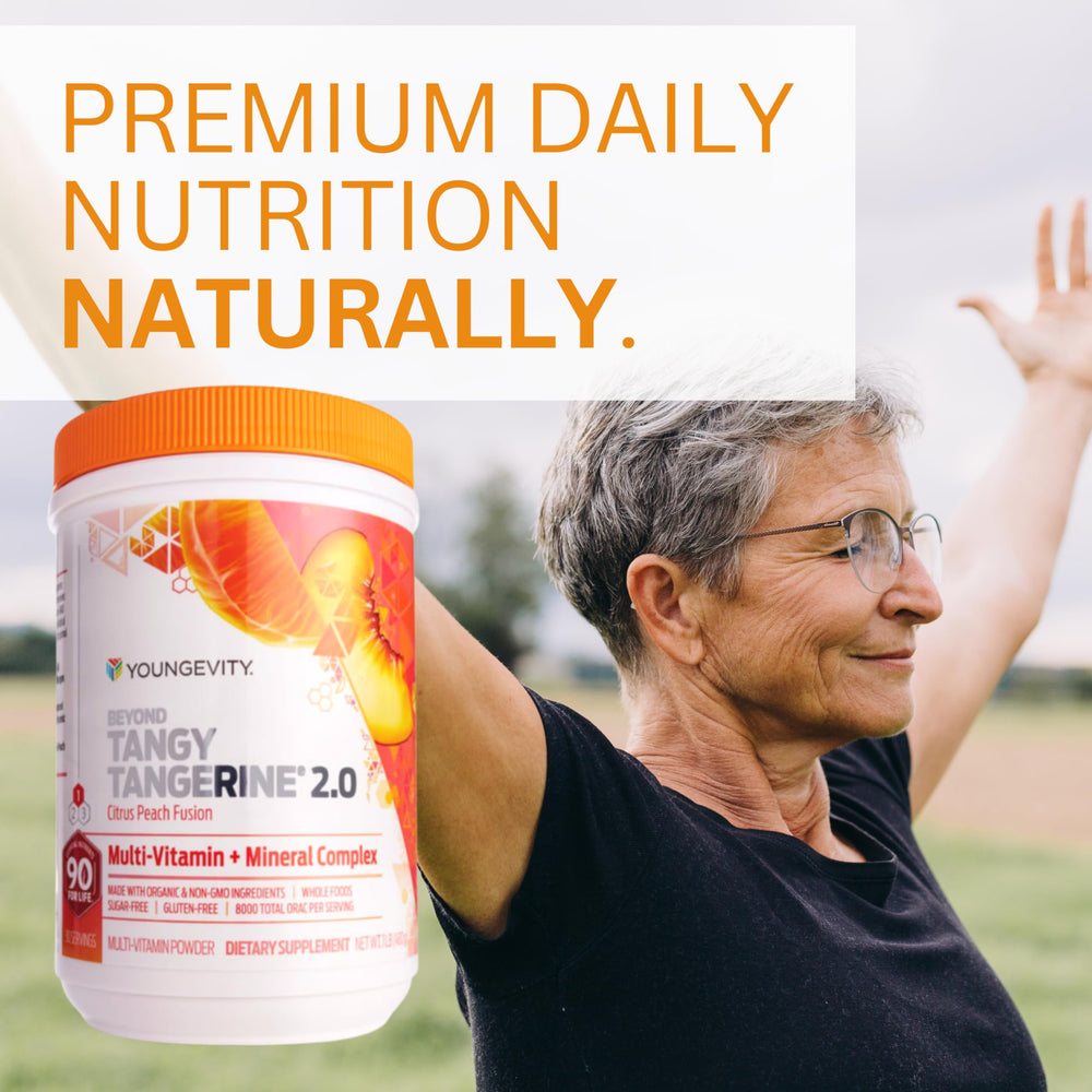 Youngevity Beyond Tangy Tangerine 2.0 pour-spoon demonstrates easy mixing for daily use.