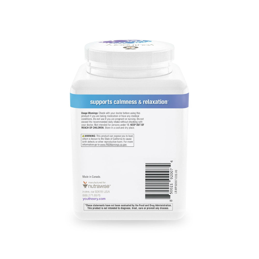 Youtheory Relax magnesium powder in a glass with a berry-flavored stir