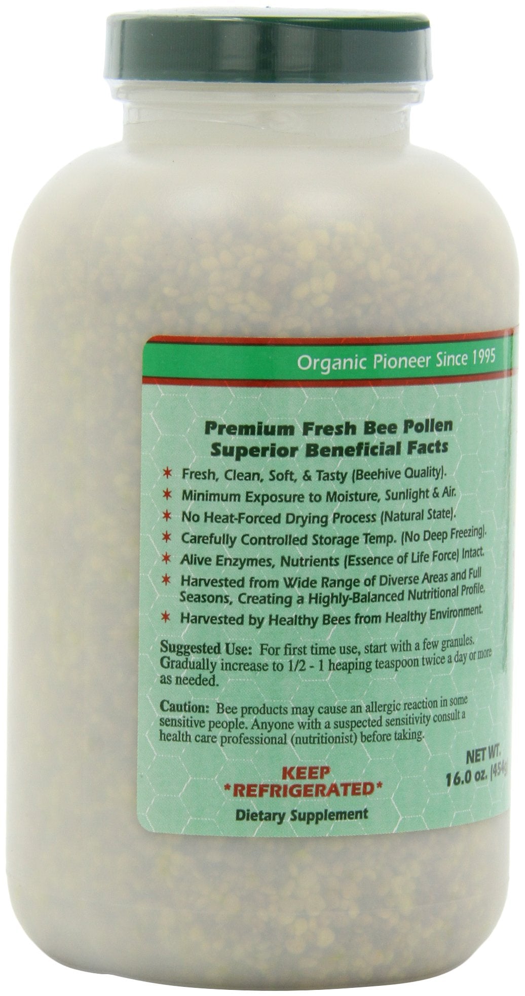 Open glass jar of bee pollen ready to scoop