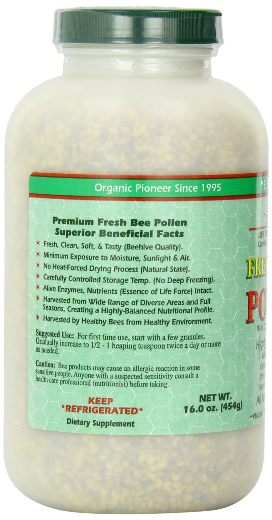 Bee pollen granules in wooden spoon ready to top yogurt