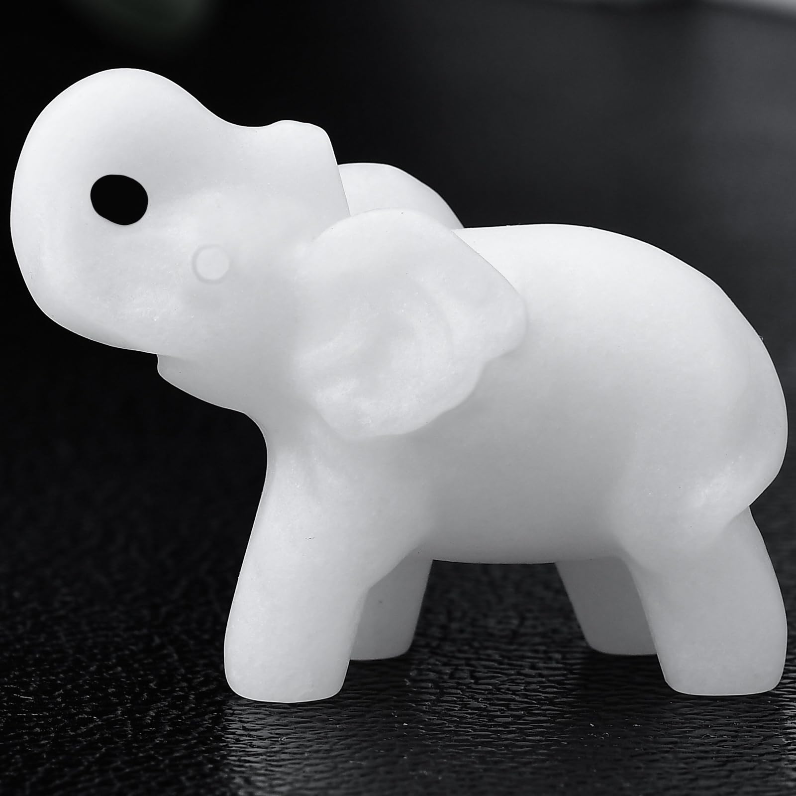 Ytbeoxk white jade elephant figurine close-up showing smooth finish and calming desk presence.