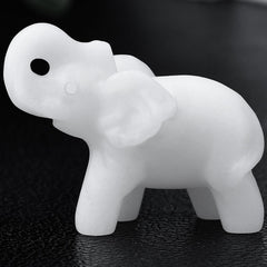 Ytbeoxk white jade elephant figurine close-up showing smooth finish and calming desk presence.