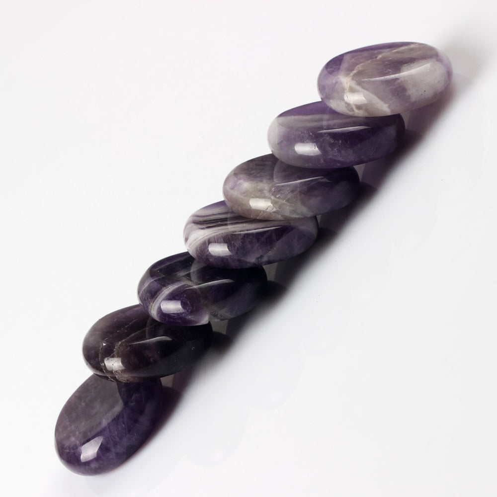YWG Stone Amethyst palm stone highlighted for chakra work and energy focus