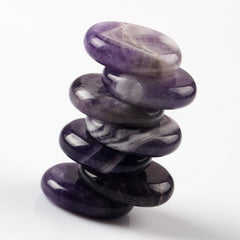 YWG Stone Amethyst palm stone in hand for tactile mindfulness