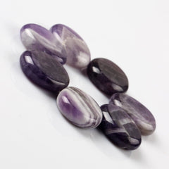 YWG Stone Amethyst palm stone showing smooth polished surface for on-the-go use
