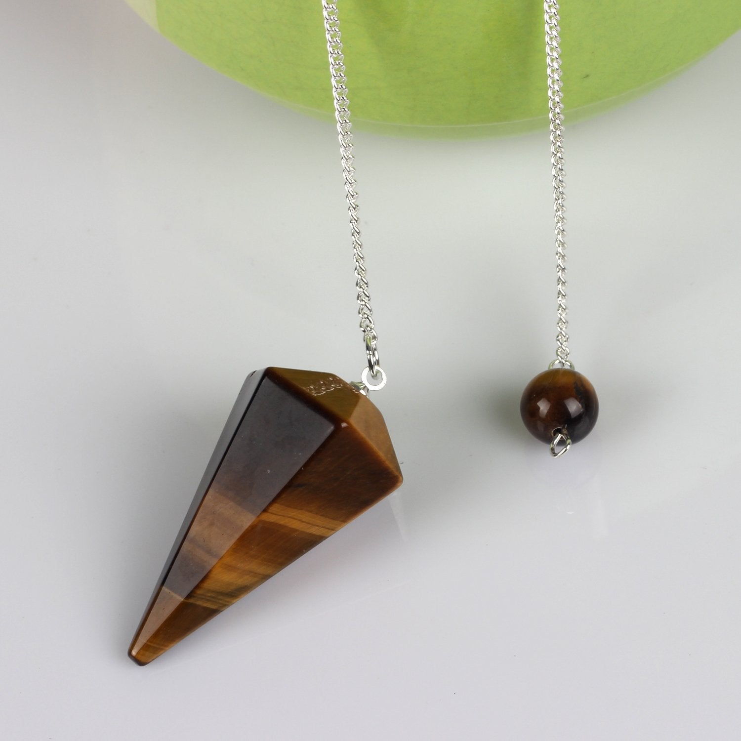 YWG Stone Tiger Eye Pendulum – closeup highlighting natural inclusions and polished facets