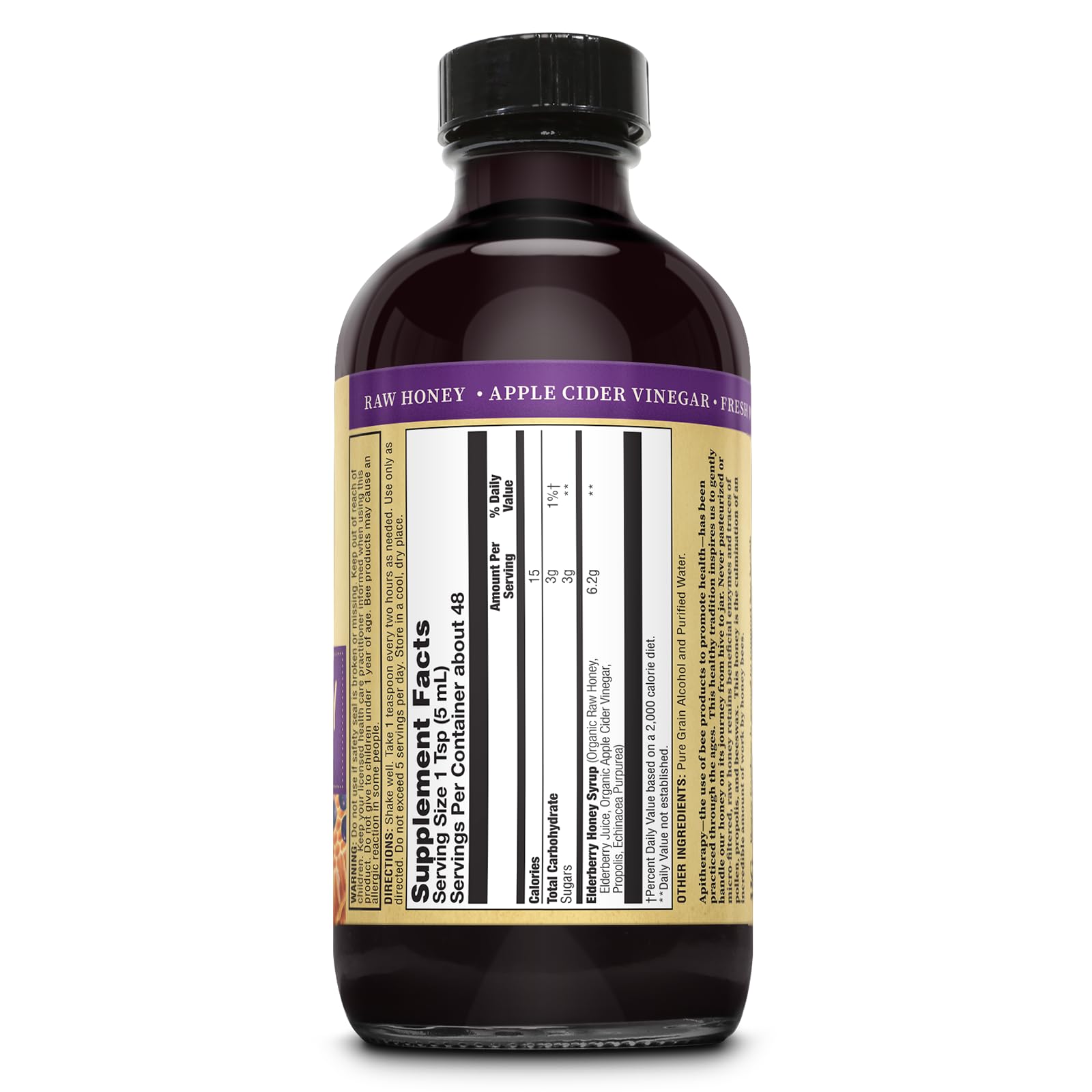Pouring ZAND Honey Gardens Elderberry Syrup shows smooth consistency and deep hue.