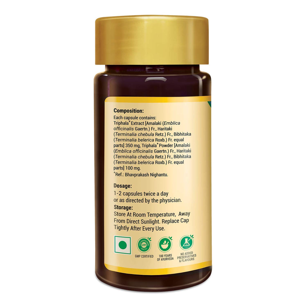 Zandu Triphala capsules inside glass, easy daily dose.