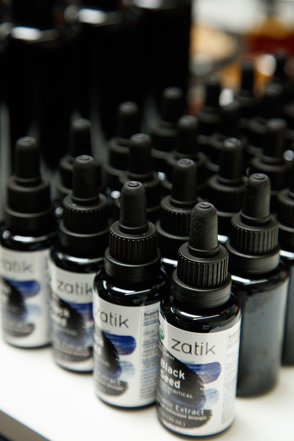 Zatik glass bottle with dropper prepared for precise dosing.